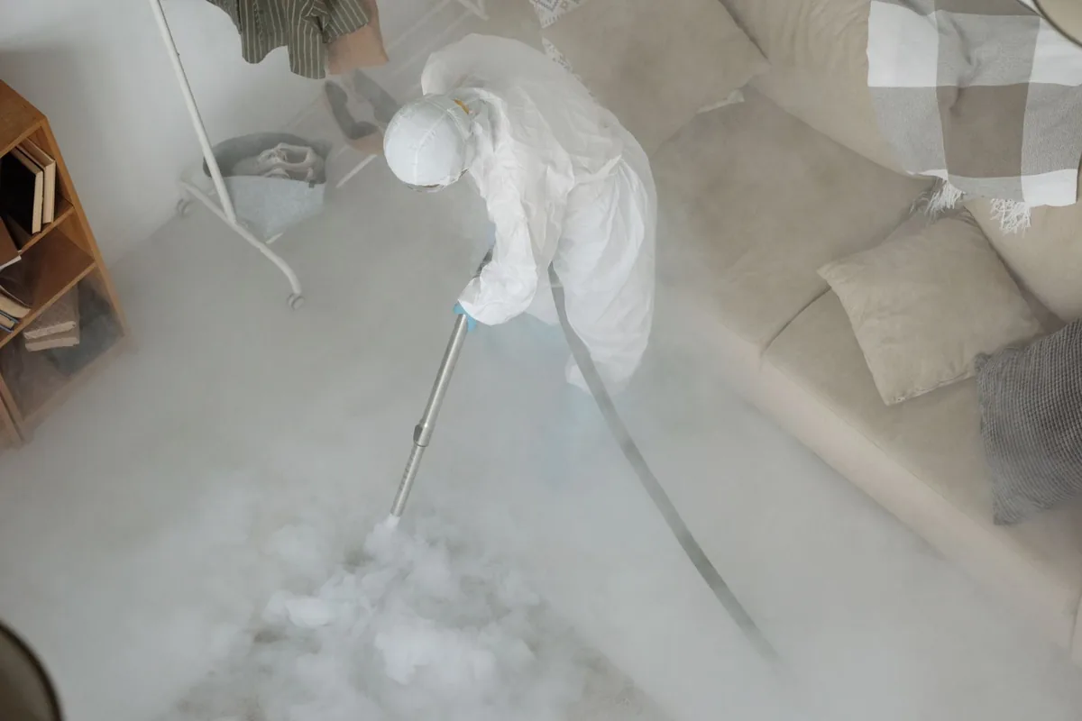 Biohazard cleanup technician in protective equipment, Olney, Philadelphia, PA